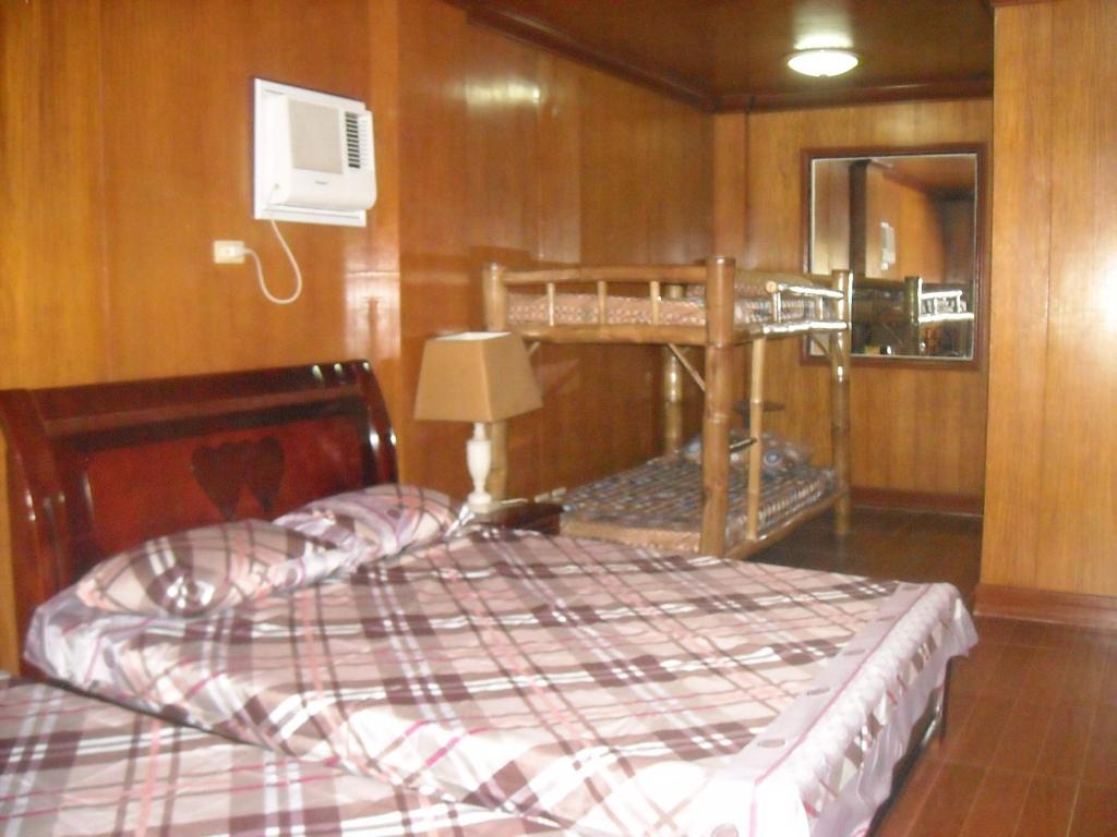 Postel nebo postele na pokoji v ubytování Cebu Guest Inn