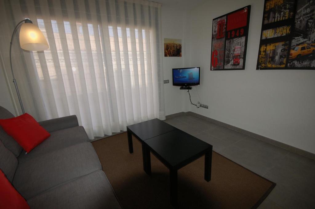 TV a/nebo společenská místnost v ubytování Sitges Apartment