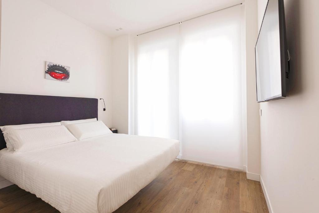 Posteľ alebo postele v izbe v ubytovaní Fiorentini Residence MILANO