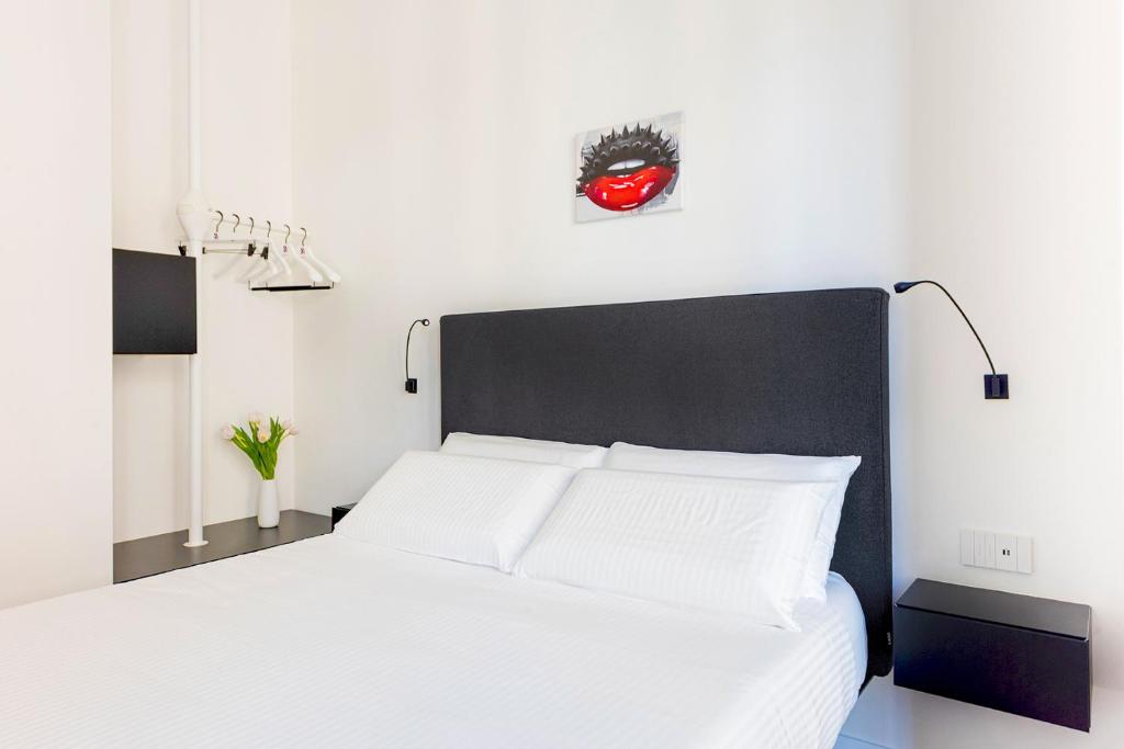 Posteľ alebo postele v izbe v ubytovaní Fiorentini Residence MILANO