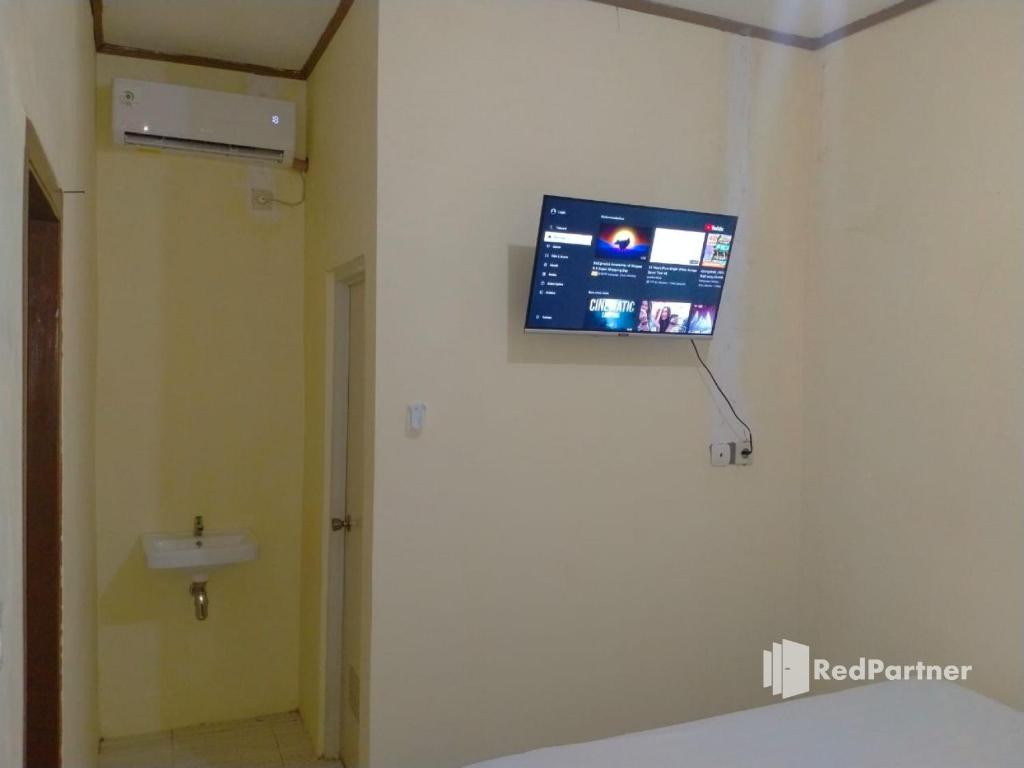 Koupelna v ubytování Navisha Guest House Syariah near Exit Tol Batang RedPartner