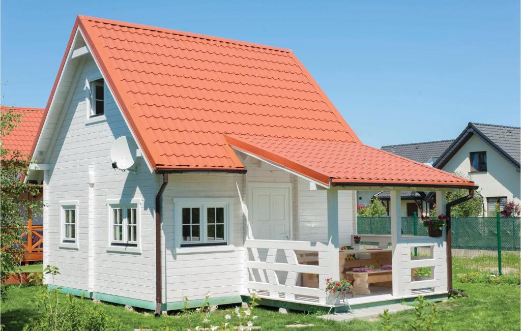 an orange roofed tiny house with an orange roof at 1 Bedroom Amazing Home In Ustka in Ustka