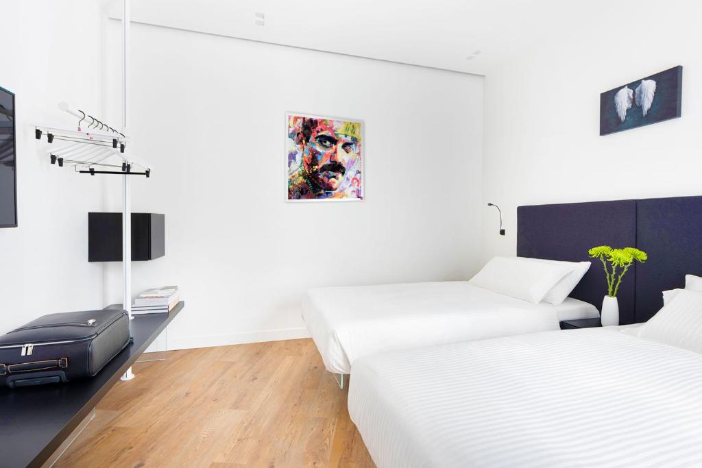 Posteľ alebo postele v izbe v ubytovaní Fiorentini Residence MILANO