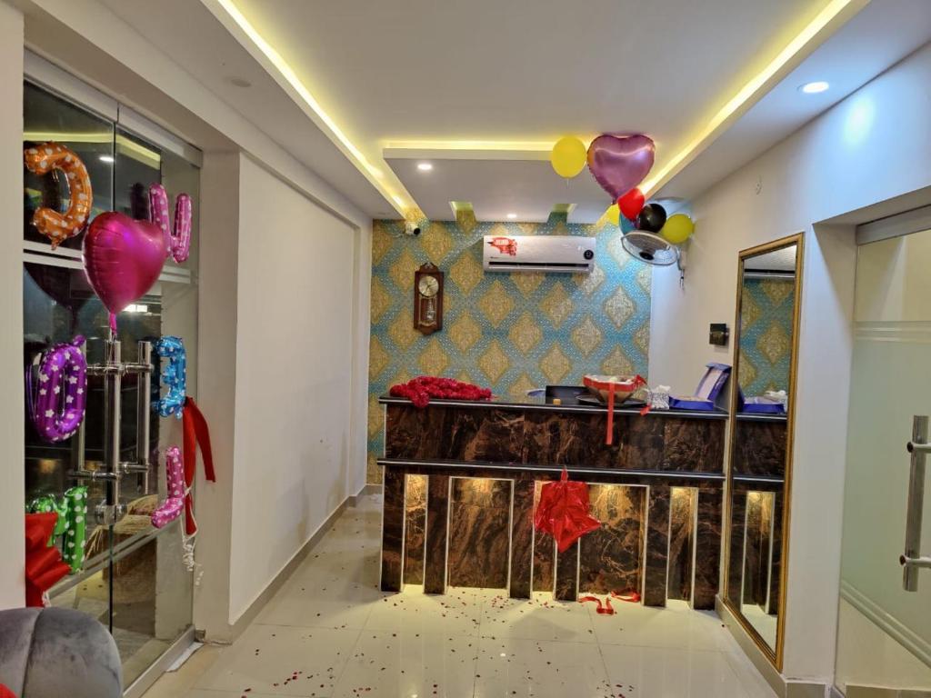 a room with balloons and a counter at Red Fort Hotel Gulberg in Lahore