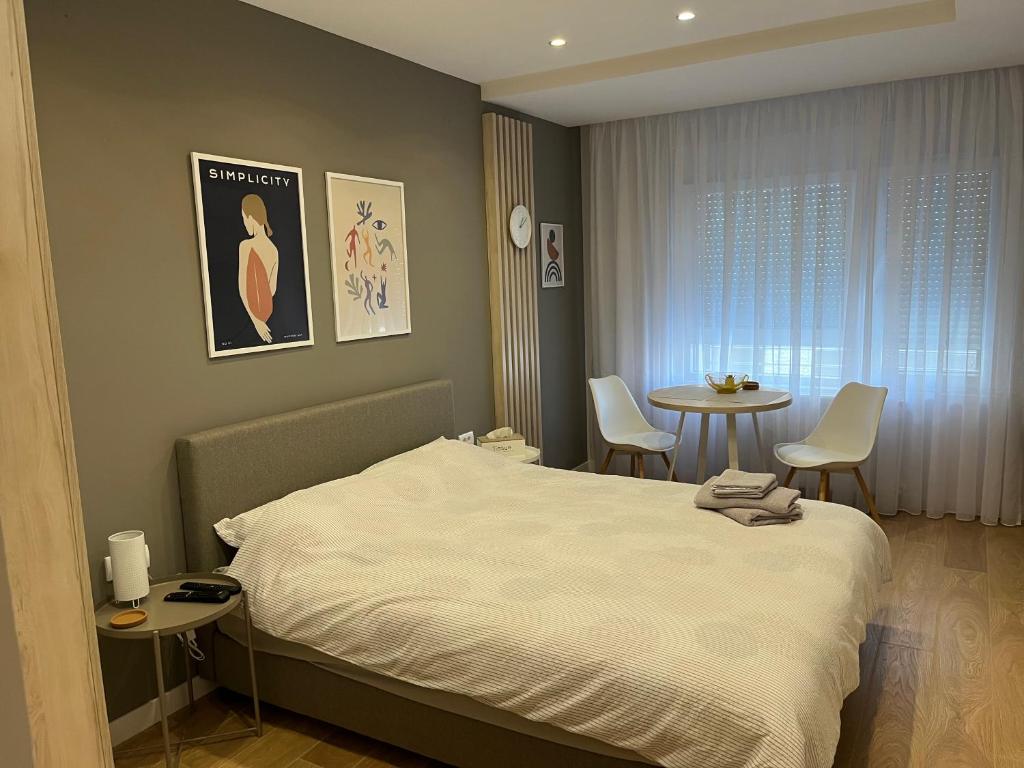 Postel nebo postele na pokoji v ubytování PRONTO apartman & PRONTO studios