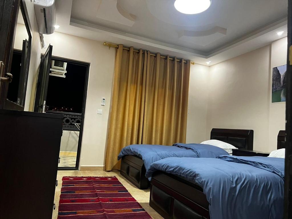 Postel nebo postele na pokoji v ubytování Amro Petra Apartment