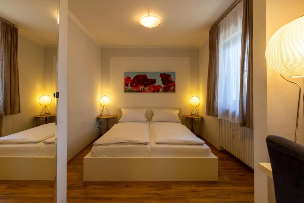 Postel nebo postele na pokoji v ubytování Gästehaus Guggenberger