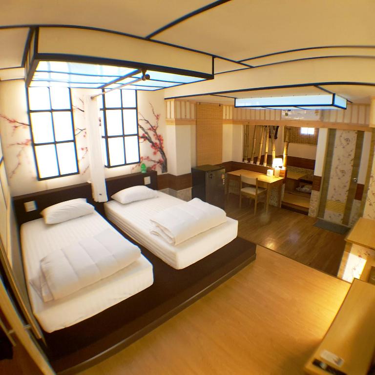 Tempat tidur dalam kamar di โรงแรมชิบะรูม นครราชสีมา เซ็นทรัลโคราช