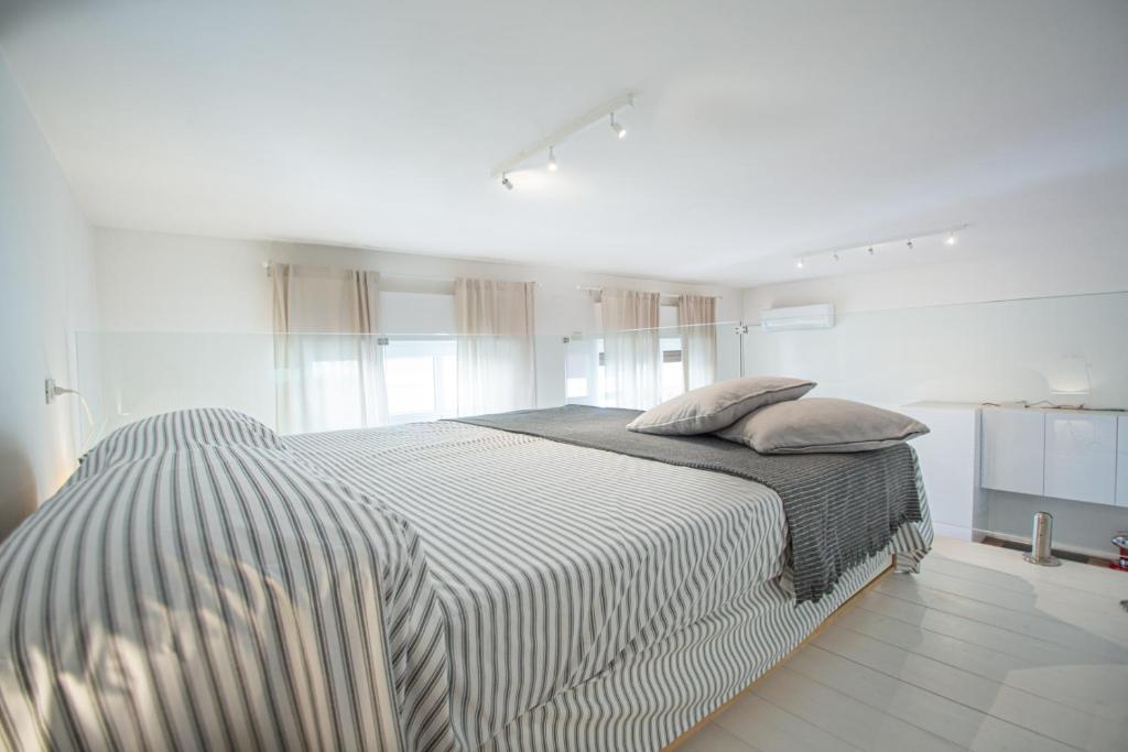 Posteľ alebo postele v izbe v ubytovaní Casa Ravenna - Pescara Centro