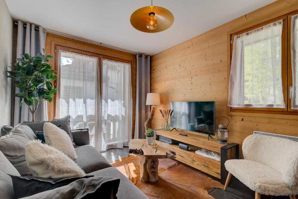 Televízia a/alebo spoločenská miestnosť v ubytovaní Apartment Aiguille de Chamonix- Alpes Travel - Central Chamonix (sleeps 4)