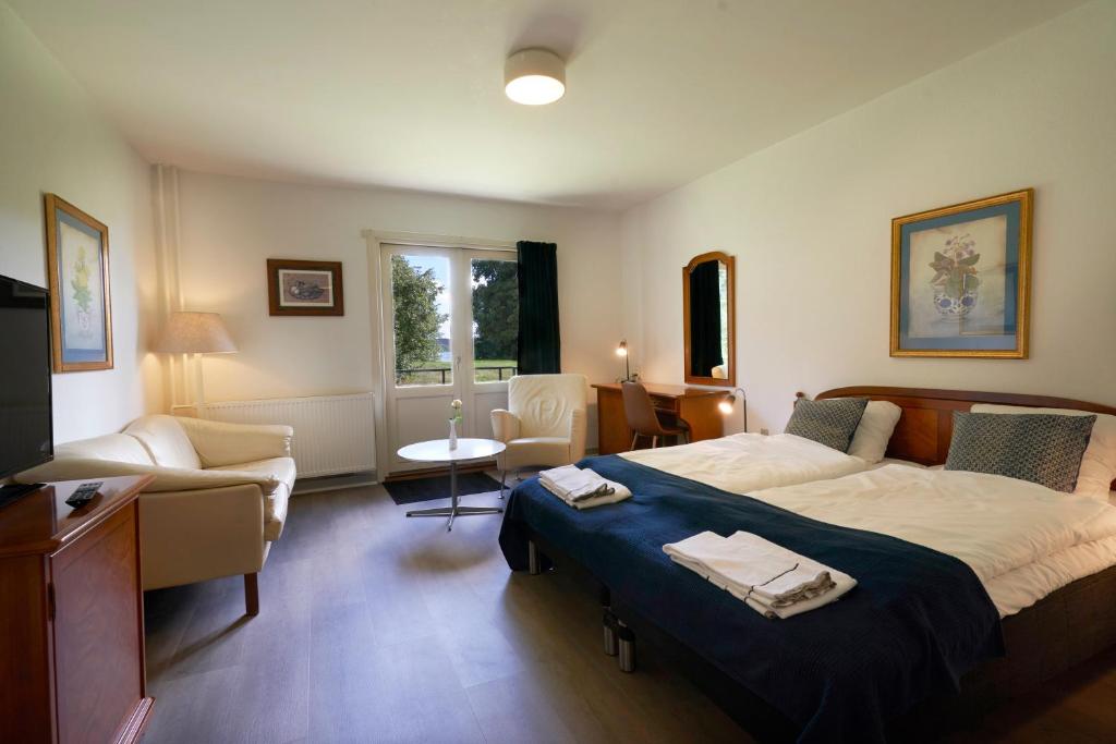 Voodi või voodid majutusasutuse Hotel Skanderborghus toas