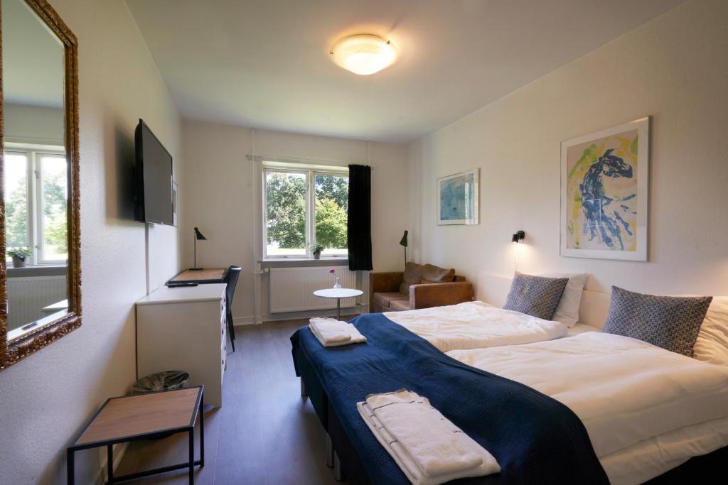 Voodi või voodid majutusasutuse Hotel Skanderborghus toas