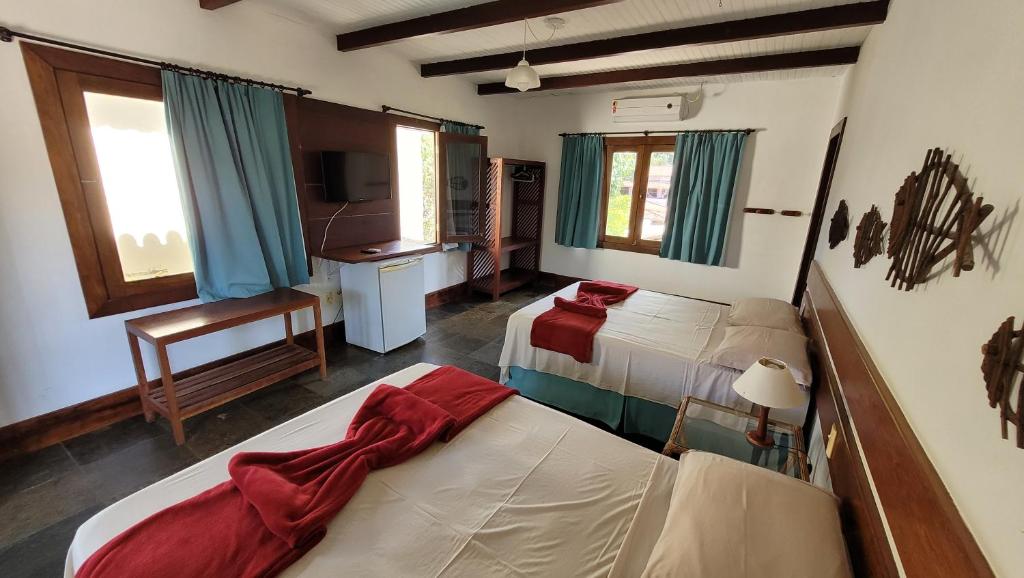 Postel nebo postele na pokoji v ubytování Taipabas Hotel