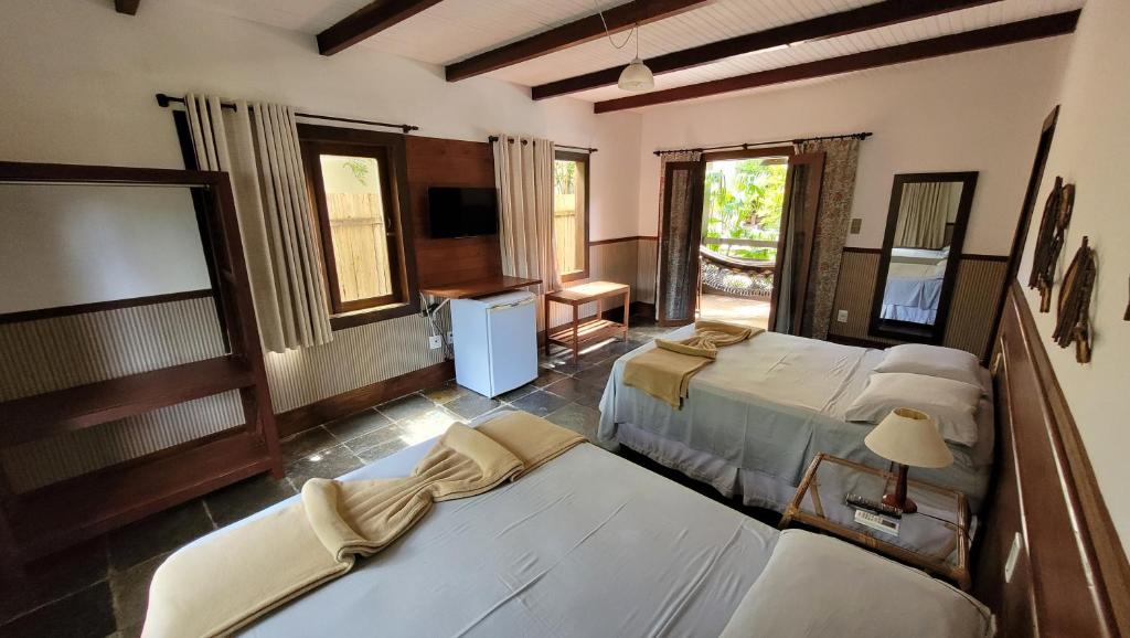 Postel nebo postele na pokoji v ubytování Taipabas Hotel