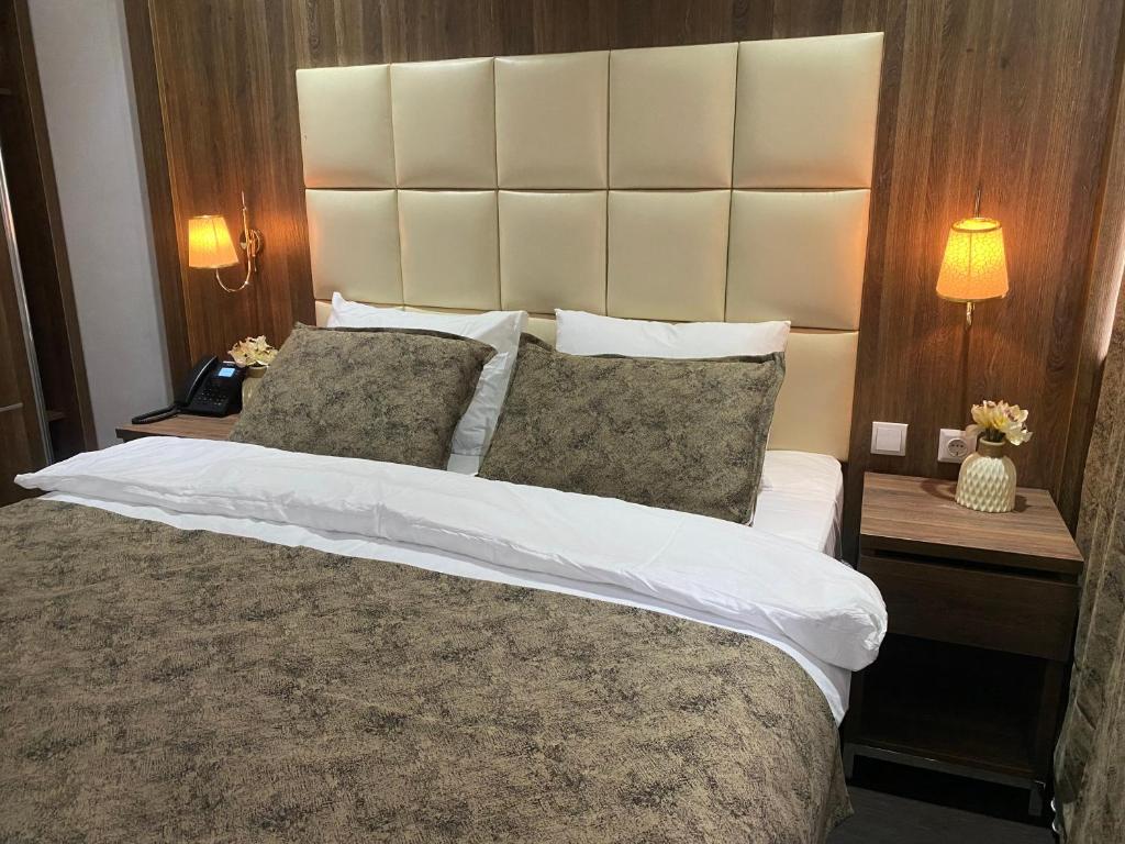 Postel nebo postele na pokoji v ubytování Hotel Cataleya