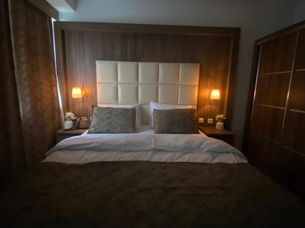 Postel nebo postele na pokoji v ubytování Hotel Cataleya