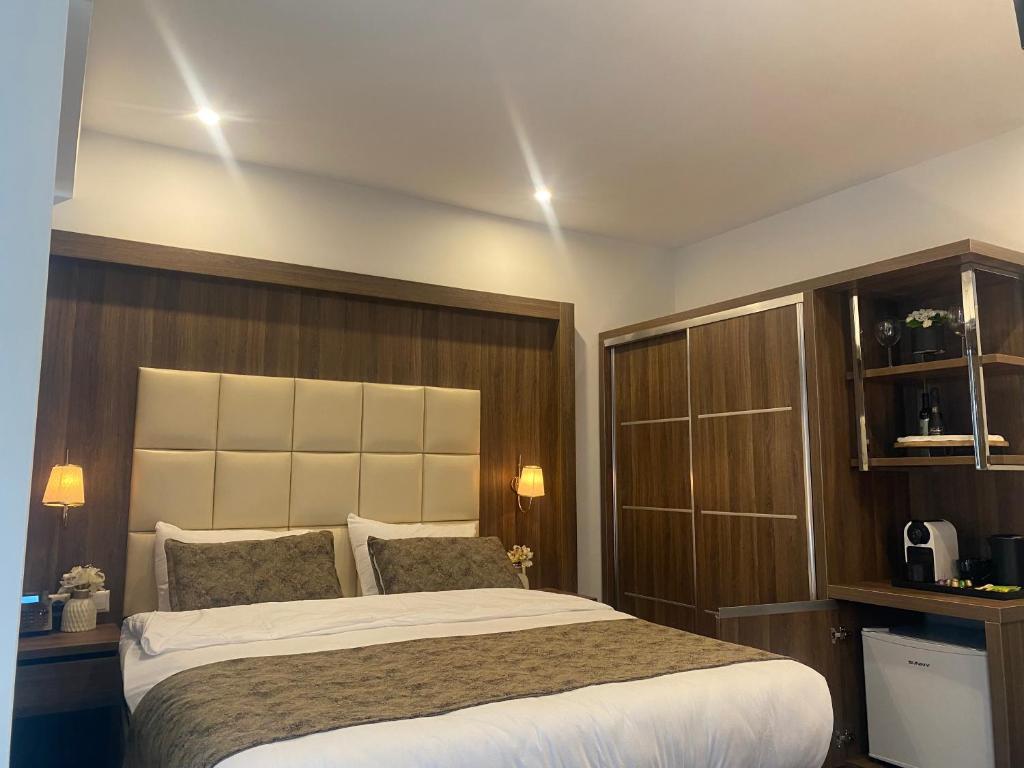 Postel nebo postele na pokoji v ubytování Hotel Cataleya