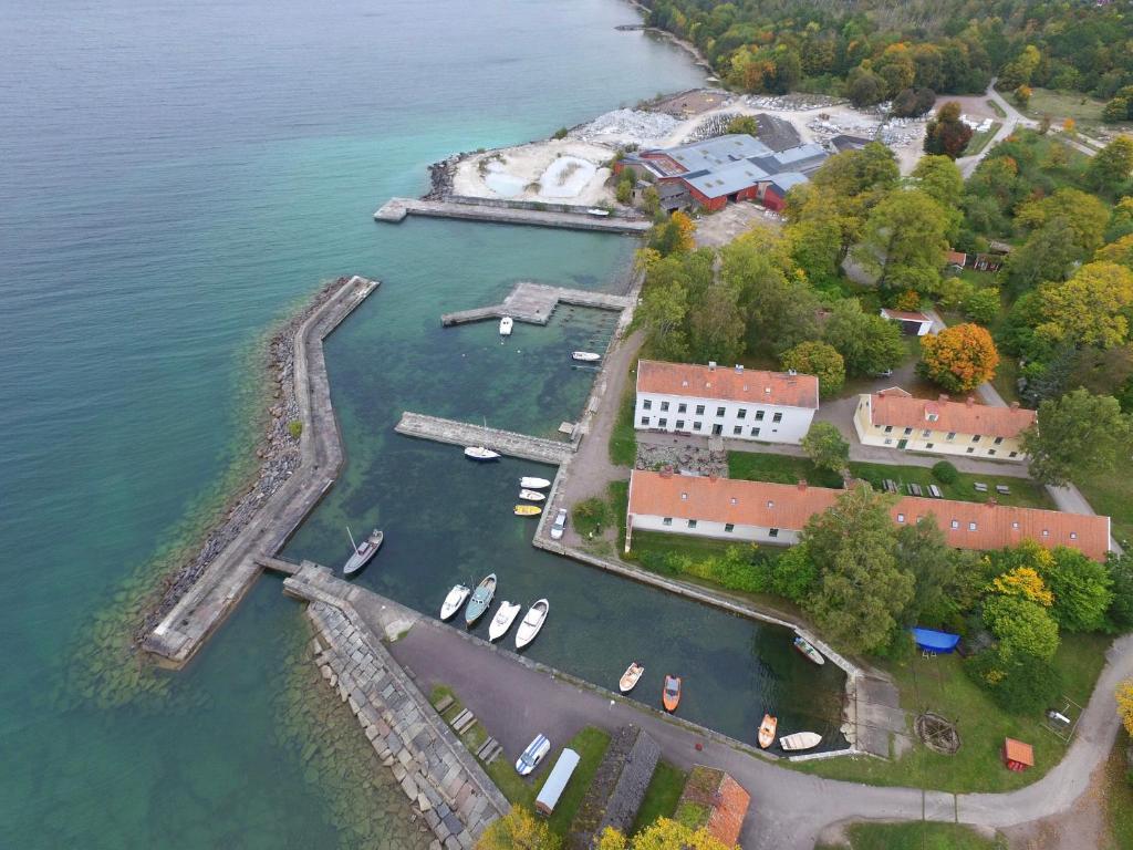 an aerial view of a harbor with boats in the water at Borghamn Strand in Borghamn