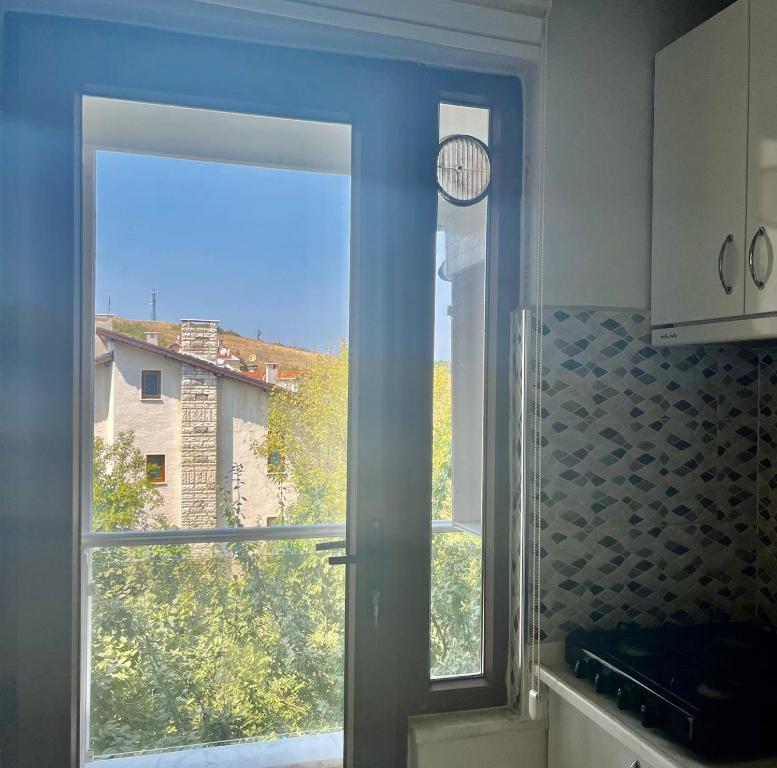 a kitchen window with a view of a building at Halic Apart Hotel in Yalova