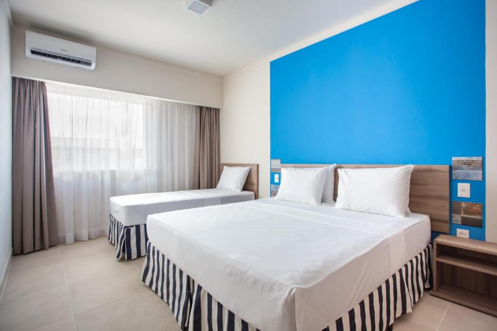 Postel nebo postele na pokoji v ubytování Ondas Praia Resort