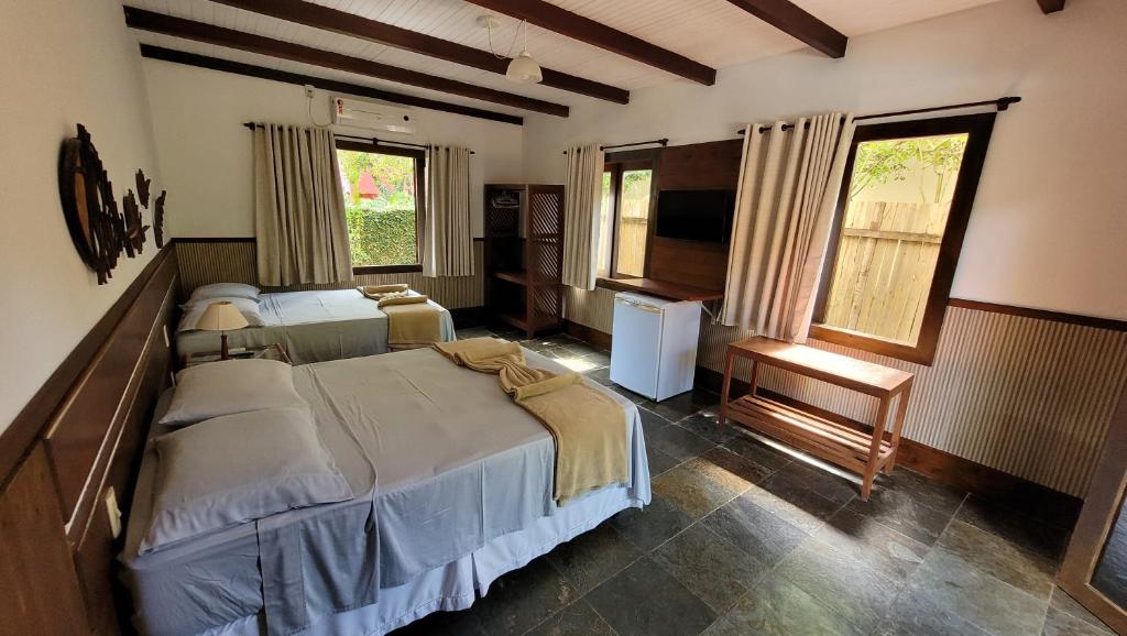 Postel nebo postele na pokoji v ubytování Taipabas Hotel