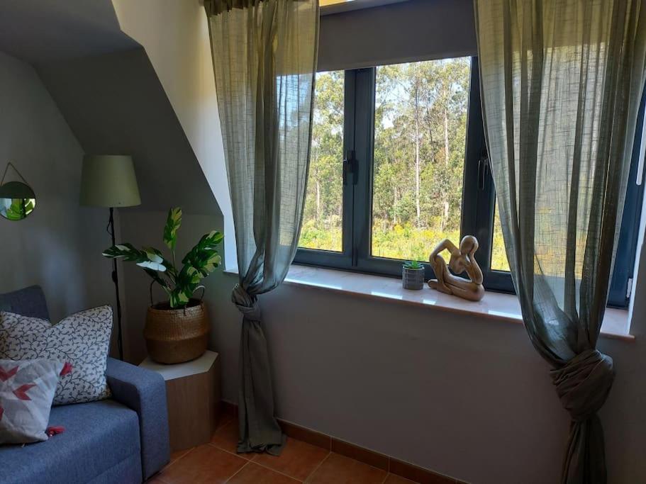 A seating area at APARTAMENTO PLAYA DE ESTORDE - Piscina y playa en el corazon da Costa da Morte