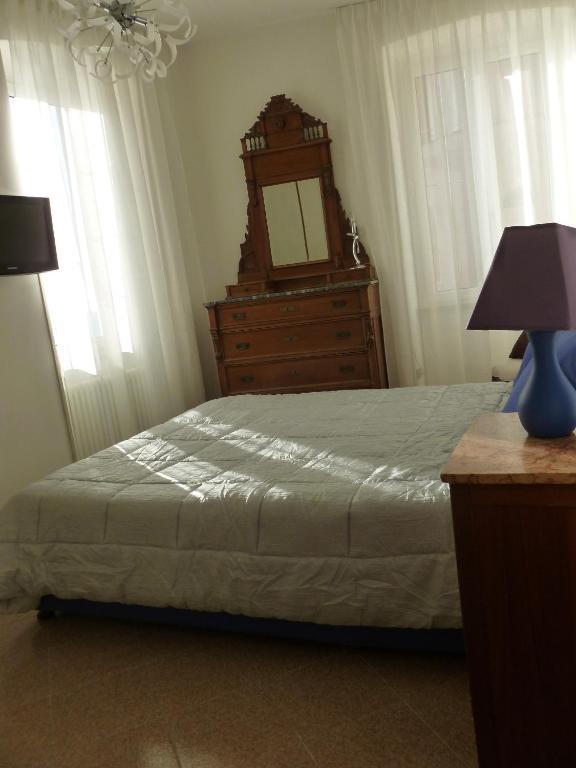 Postel nebo postele na pokoji v ubytování Camere Nicolina