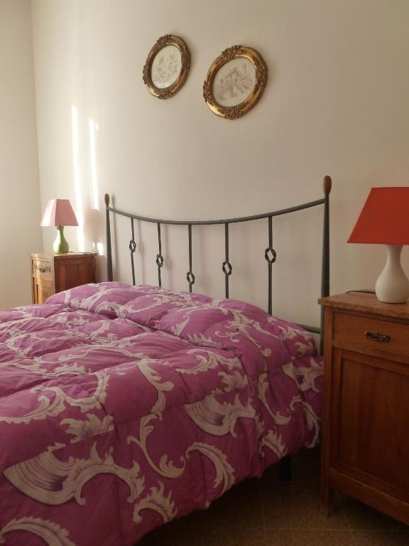Postel nebo postele na pokoji v ubytování Camere Nicolina