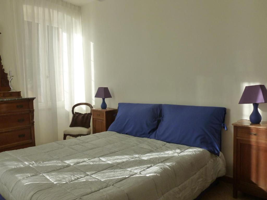 Postel nebo postele na pokoji v ubytování Camere Nicolina