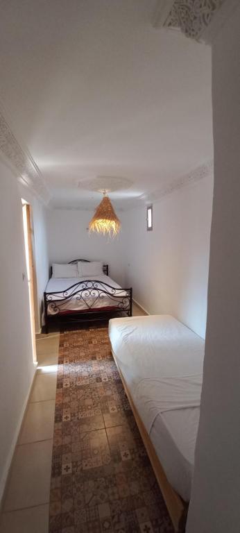 Postel nebo postele na pokoji v ubytování Riad chaoui house