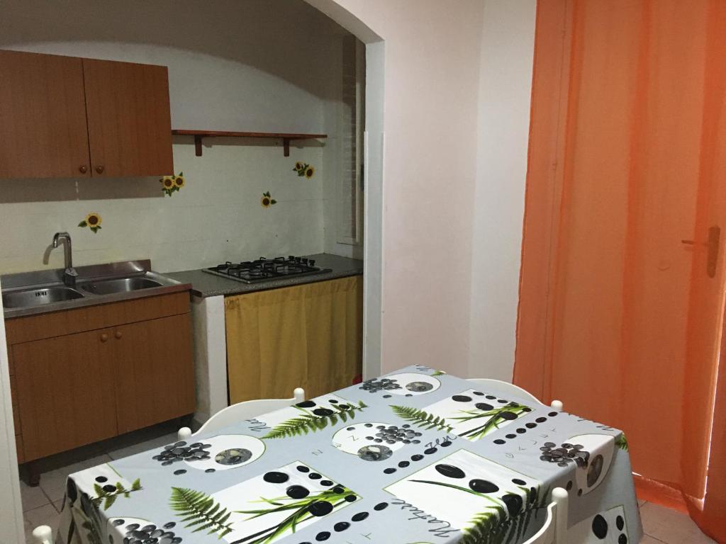 Kuchyň nebo kuchyňský kout v ubytování Residence La Quiete
