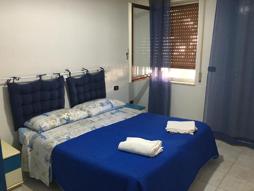 Postel nebo postele na pokoji v ubytování Residence La Quiete