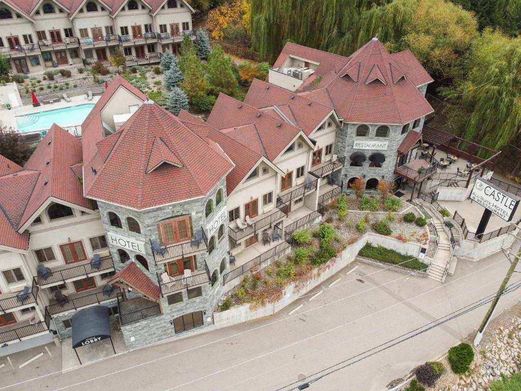 an aerial view of a large house with red roof at The Castle at Swan Lake in Vernon