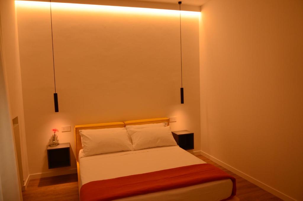A bed or beds in a room at La Cicada