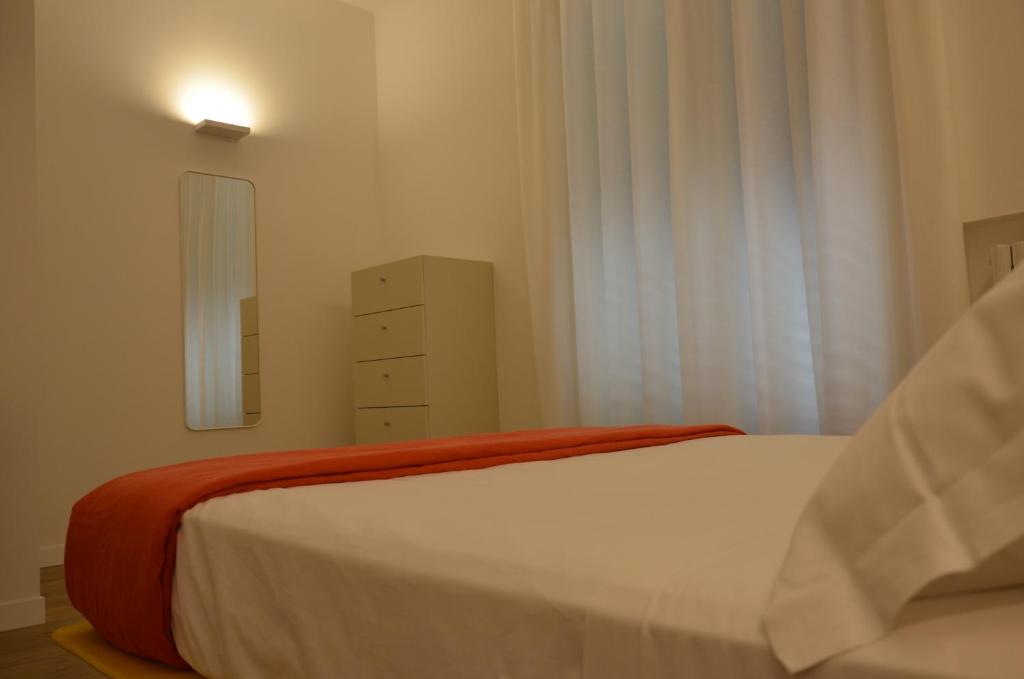 A bed or beds in a room at La Cicada