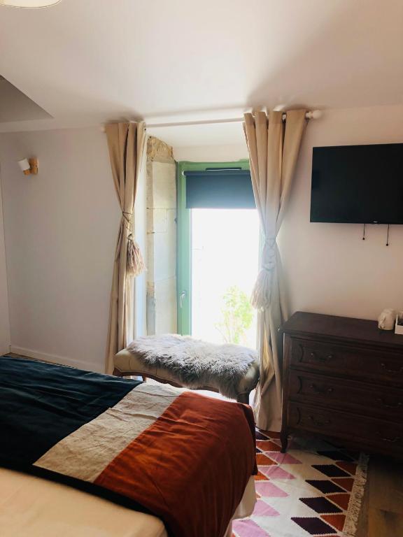 Postel nebo postele na pokoji v ubytování Le Gite de Tassigny