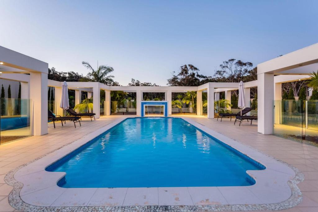 an image of a swimming pool in a house at One Mile Mansion - Private Coastal Retreat in One Mile