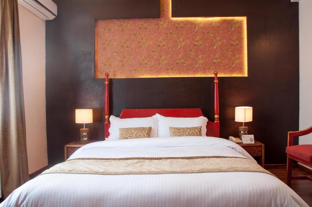 Postel nebo postele na pokoji v ubytování Mandala Boutique Hotel
