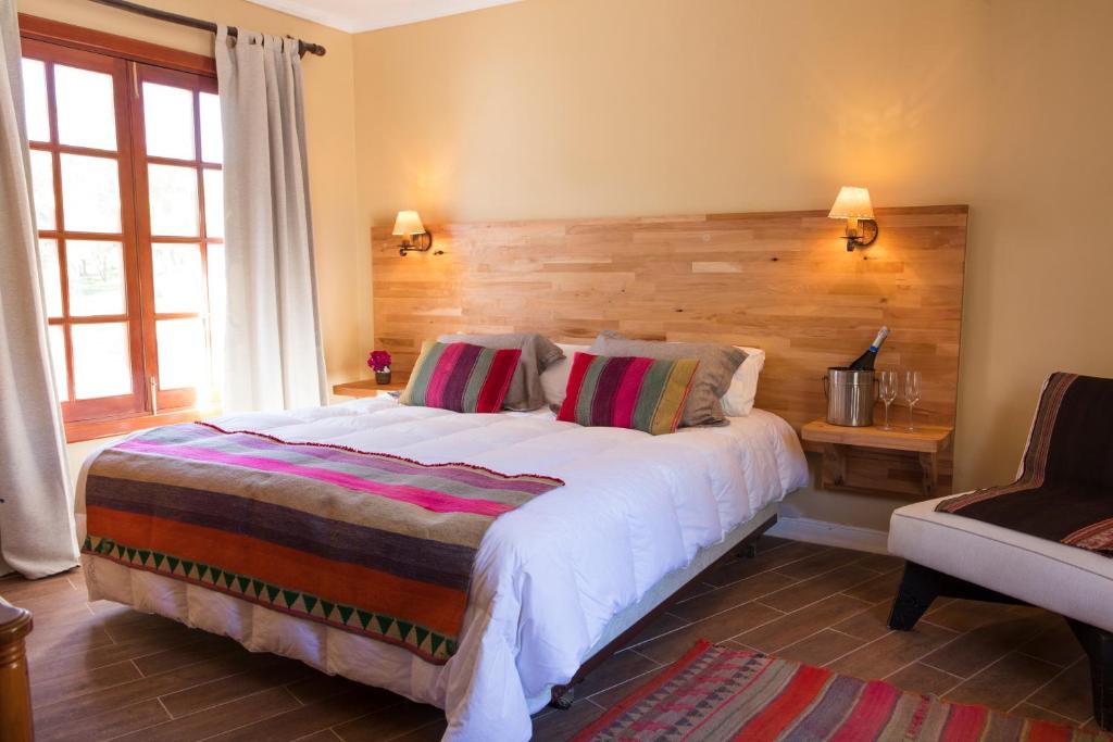 Postel nebo postele na pokoji v ubytování Hotel Viña Kankura