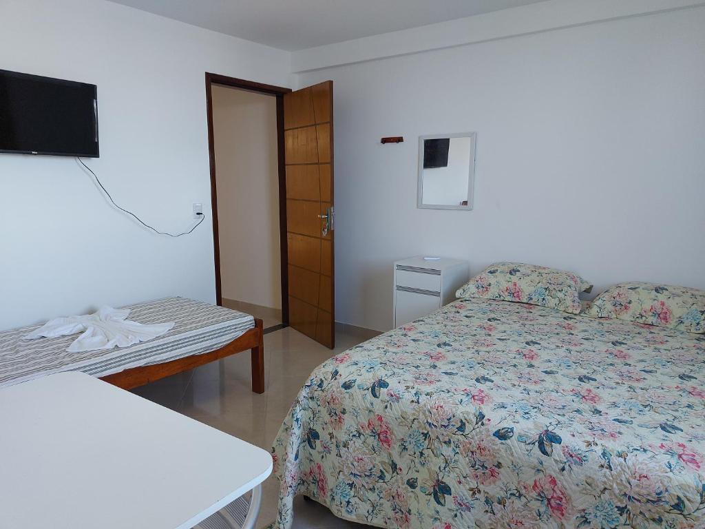 Postel nebo postele na pokoji v ubytování Casarão Nazaré Hostel