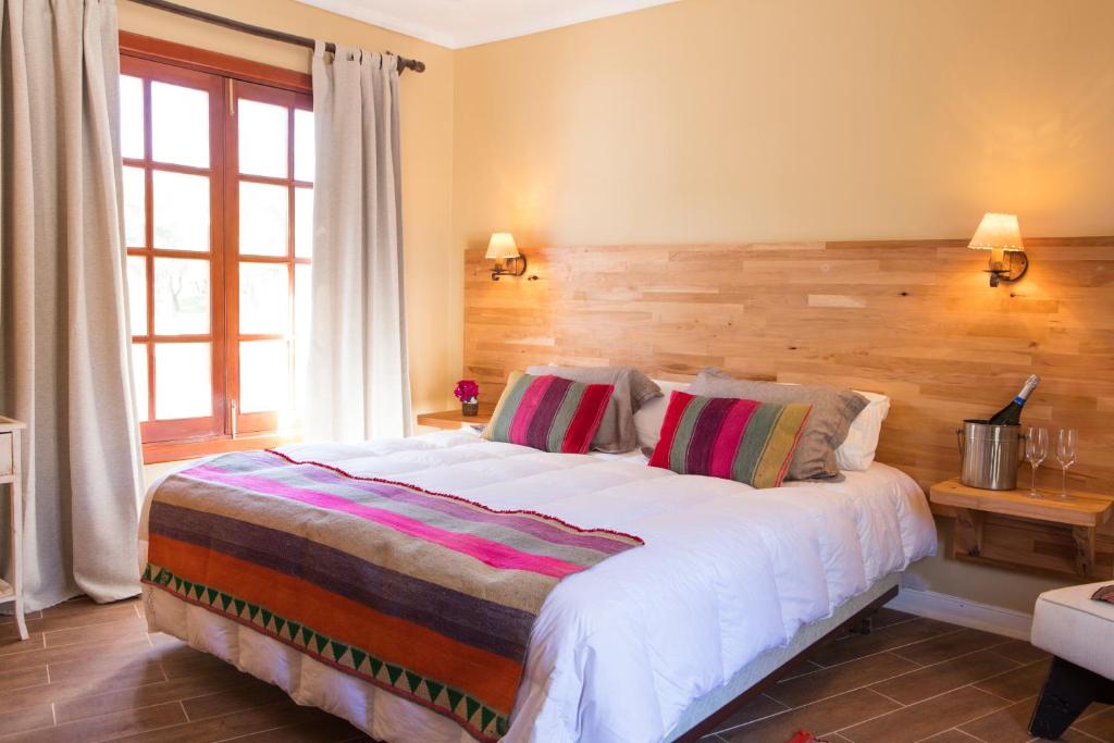 Postel nebo postele na pokoji v ubytování Hotel Viña Kankura
