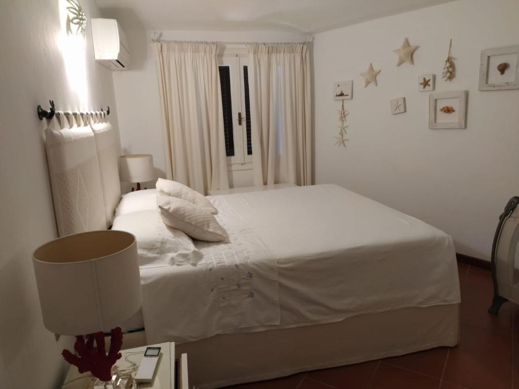 Lova arba lovos apgyvendinimo įstaigoje Appartamento Porto Cervo Dolce Sposa