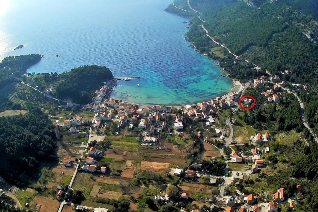 an aerial view of a small town next to the water at Apartments by the sea Zuljana, Peljesac - 19080 in Žuljana