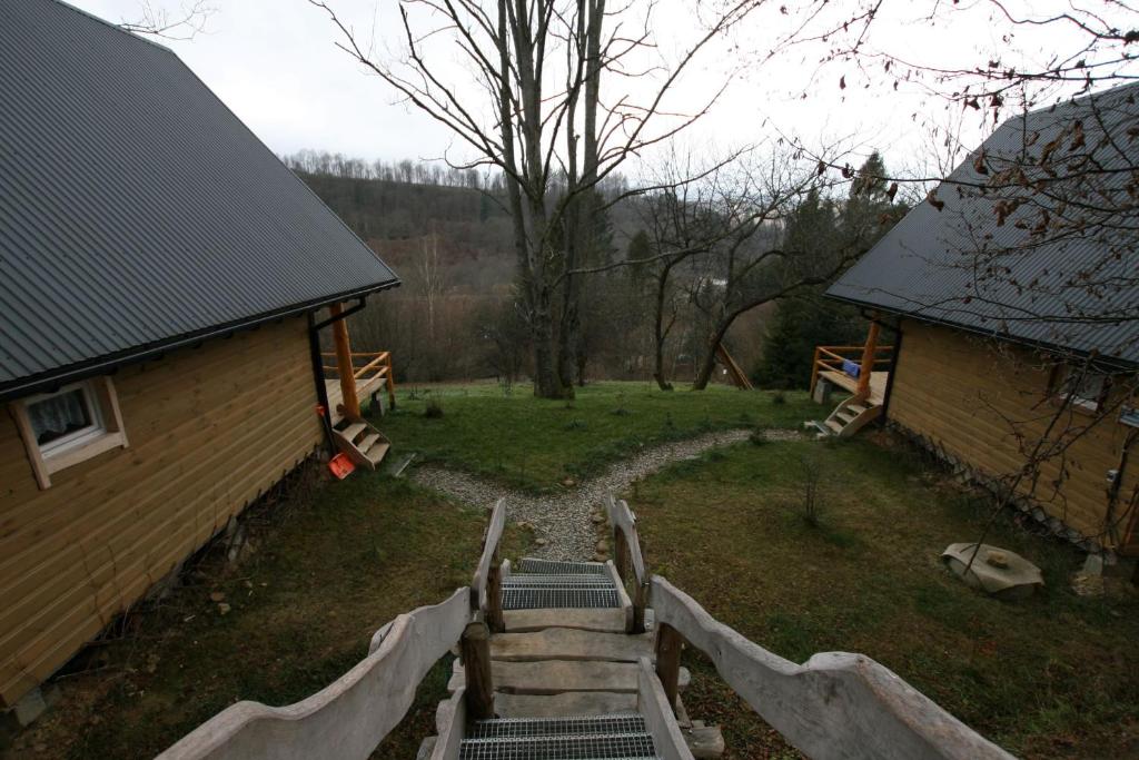 an aerial view of a yard with stairs next to a house at LESZCZYNOWY STOK in Lutowiska