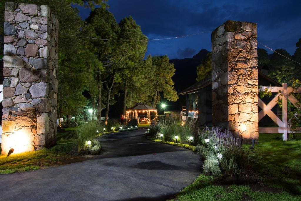 a path leading to a building at night with lights at Orgánico Hotel Boutique in Mexico City