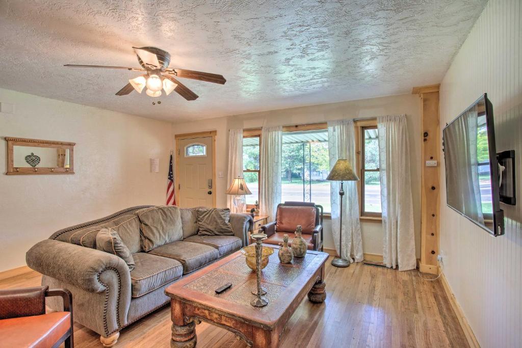 a living room with a couch and a table at Well-Appointed Fruita Townhome Hike and Bike Nearby in Fruita