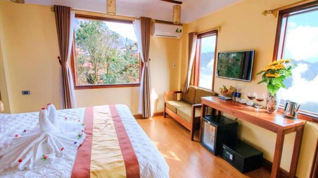 Postel nebo postele na pokoji v ubytování Heart Of Sapa Hotel