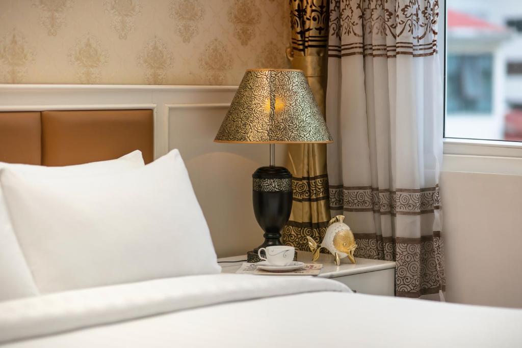 Postel nebo postele na pokoji v ubytování Luxor Boutique Hotel