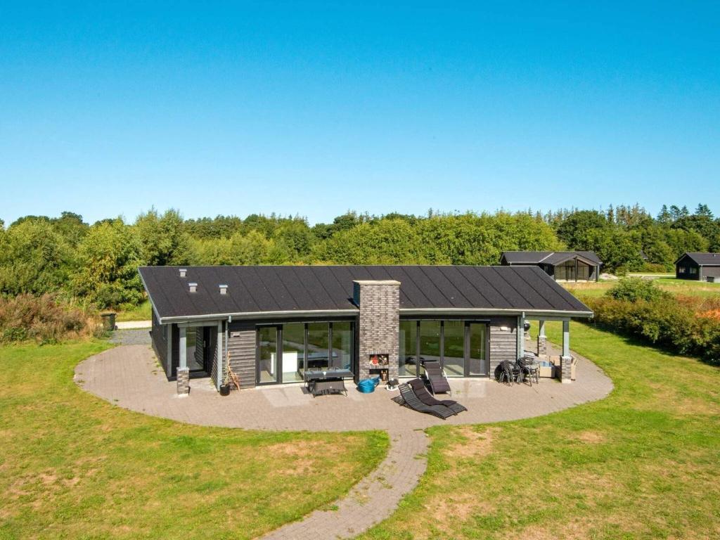 an overhead view of a house with a patio at Holiday home Glesborg L in Glesborg