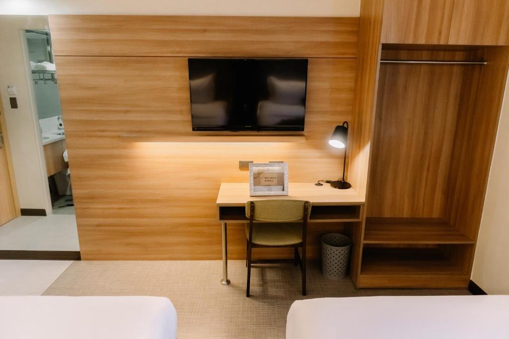 TV a/nebo společenská místnost v ubytování L' Meridian Suites